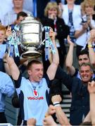 7 July 2013; Dublin captain John McCaffrey lifts the Bob O'Keeffe Cup at the end of the game, watched on by former Dublin manager Humphrey Kelleher to his left. Leinster GAA Hurling Senior Championship Final, Galway v Dublin, Croke Park, Dublin. Picture credit: Ray McManus / SPORTSFILE
