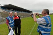 6 July 2013; Hugh Lynn takes a picture of Tyrone manager Mickey Harte and match stewart Seamus Regan before the game against Roscommon. GAA Football All-Ireland Senior Championship, Round 2, Roscommon v Tyrone, Dr Hyde Park, Roscommon. Picture credit: Matt Browne / SPORTSFILE
