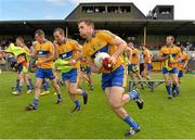 6 July 2013; Clare's Gary Brennan and team-mates break away from the traditional team photograph before the game. GAA Football All-Ireland Senior Championship, Round 2, Clare v Laois, Cusack Park, Ennis, Co. Clare. Picture credit: Diarmuid Greene / SPORTSFILE