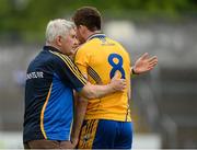 6 July 2013; Clare's Gary Brennan gets a pat on the back from manager Mick O'Dwyer. GAA Football All-Ireland Senior Championship, Round 2, Clare v Laois, Cusack Park, Ennis, Co. Clare. Picture credit: Diarmuid Greene / SPORTSFILE