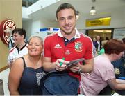 10 July 2013; Tommy Bowe, British & Irish Lions, pictured with Ulster supporter Jacqui Rock on his arrival home following the side's series victory over Australia in the British & Irish Lions Tour 2013. George Best Belfast City Airport, Belfast, Co. Antrim. Picture credit: John Dickson / SPORTSFILE