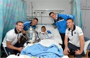 11 July 2013; Dublin hurlers share their victory with children at Temple Street Children's University Hospital. Pictured are Dublin's, from left, Kevin Byrne, Michael Carton, Peter Kelly and John McCaffrey with thirteen year old Jordan Pitshoa, from Finglas, Dublin, and the Bob O'Keeffe Cup during a visit to Temple Street Children's University Hospital, Temple Street, Dublin. Picture credit: Matt Browne / SPORTSFILE