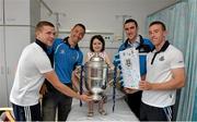 11 July 2013; Dublin hurlers share their victory with children at Temple Street Children's University Hospital. Pictured is Dublin captain John McCaffrey with a card made by five year old Chloe Walsh, from Minane Bridge, Carrigaline, Co. Cork, who is holding the Bob O'Keeffe Cup with Dublin players, from left, Kevin Byrne, Michael Carton and Peter Kelly during a visit to Temple Street Children's University Hospital, Temple Street, Dublin. Picture credit: Matt Browne / SPORTSFILE