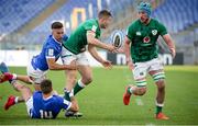 27 February 2021; Jordan Larmour of Ireland offloads to team-mate Will Connors, right, as he is tackled by Juan Ignacio Brex and Luca Sperandio of Italy to set up their side's third try during the Guinness Six Nations Rugby Championship match between Italy and Ireland at Stadio Olimpico in Rome, Italy. Photo by Roberto Bregani/Sportsfile