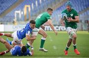 27 February 2021; Jordan Larmour of Ireland offloads to team-mate Will Connors, right, as he is tackled by Juan Ignacio Brex and Luca Sperandio of Italy to set up their side's third try during the Guinness Six Nations Rugby Championship match between Italy and Ireland at Stadio Olimpico in Rome, Italy. Photo by Roberto Bregani/Sportsfile