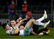 28 February 2021; Huw Jones of Glasgow Warriors is tackled by Rory O'Loughlin and Josh van der Flier of Leinster during the Guinness PRO14 match between Leinster and Glasgow Warriors at the RDS Arena in Dublin. Photo by Harry Murphy/Sportsfile