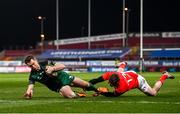 5 March 2021; Matt Healy of Connacht scores his side's first try despite the tackle of Chris Farrell of Munster during the Guinness PRO14 match between Munster and Connacht at Thomond Park in Limerick. Photo by Ramsey Cardy/Sportsfile