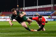 5 March 2021; Matt Healy of Connacht scores his side's first try despite the tackle of Chris Farrell of Munster during the Guinness PRO14 match between Munster and Connacht at Thomond Park in Limerick. Photo by Ramsey Cardy/Sportsfile
