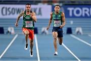 6 March 2021; Denis Dimitrov of Bulgaria, left, and Leon Reid of Ireland compete in the Men's 60m heats during the first session on day two of the European Indoor Athletics Championships at Arena Torun in Torun, Poland. Photo by Sam Barnes/Sportsfile