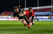 5 March 2021; Matt Healy of Connacht on his way to scoring his side's first try despite the tackle of Chris Farrell of Munster during the Guinness PRO14 match between Munster and Connacht at Thomond Park in Limerick. Photo by Ramsey Cardy/Sportsfile
