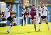 6 March 2021; Chris Lyons of Drogheda United in action against Raivis Jurkovskis, left, and Daniel Cleary of Dundalk during the Jim Malone Cup match between Drogheda United and Dundalk at Head In The Game Park in Drogheda, Louth. Photo by Stephen McCarthy/Sportsfile