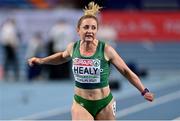 7 March 2021; Joan Healy of Ireland crosses the line to finish eighth in the Women's 60m heats during the first session on day three of the European Indoor Athletics Championships at Arena Torun in Torun, Poland. Photo by Sam Barnes/Sportsfile