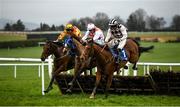 9 March 2021; Hilltop Supreme, with Kevin Brouder up, left, clear the last alongside Added Bonus, with Ambrose McCurtin up, right, who came second and Crack on Corrie, with Simon Torrens up, who came third, on their way to winning the Kilmolash Handicap hurdle at Clonmel Racecourse in Tipperary. Photo by David Fitzgerald/Sportsfile