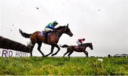 10 March 2021; Defi Bleu, with Jack Kennedy up, right, clear the last ahead of Opposites Attract, with Colin Maxwell up, on their way to winning the Tomcoole Farm Ltd. beginners steeplechase at Wexford Racecourse in Wexford. Photo by David Fitzgerald/Sportsfile