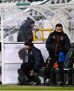 12 March 2021; Dundalk coach Filippo Giovagnoli makes his way into the stand as Dundalk team manager Shane Keegan and Dundalk coach Giuseppi Rossi sit in the dugout prior to the FAI President's Cup Final match between Shamrock Rovers and Dundalk at Tallaght Stadium in Dublin. Photo by Harry Murphy/Sportsfile