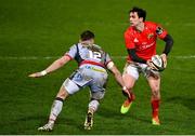 12 March 2021; Joey Carbery of Munster in action against Steff Hughes of Scarlets during the Guinness PRO14 match between Munster and Scarlets at Thomond Park in Limerick. Photo by Ramsey Cardy/Sportsfile