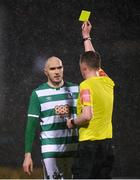 12 March 2021; Joey O'Brien of Shamrock Rovers receives a yellow card from referee Damien MacGraith during the FAI President's Cup Final match between Shamrock Rovers and Dundalk at Tallaght Stadium in Dublin. Photo by Stephen McCarthy/Sportsfile