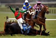 14 March 2021; Jockey Cian Quirke and mount Halsafari fall at the last during the Bar One Racing Handicap Hurdle at Naas Racecourse in Kildare. Photo by Seb Daly/Sportsfile