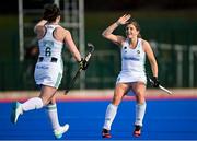 16 March 2021; Roisin Upton of Ireland, left, celebrates with team-mate Katie Mullan, after scoring her side's first goal during the SoftCo Series International Hockey match between Ireland and Great Britain at Queens University Sports Grounds in Belfast. Photo by Ramsey Cardy/Sportsfile