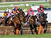 16 March 2021; Jeff Kidder, left, with Sean Flanagan up, jump the last ahead of Sage Advice, who finished sixth, and Saint Sam, right, with Paul Townend up, who finished second, on their way to winning The Boodles Juvenile Handicap Hurdle Race on day 1 of the Cheltenham Racing Festival at Prestbury Park in Cheltenham, England. Photo by Hugh Routledge/Sportsfile
