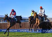 16 March 2021; Escaria Ten, with Adrian Heskin up, left, leads the eventual winner Galvin, right, with Jack Kennedy up, and Next Destination, with Harry Cobden up, over the last during The Sam Vestey National Hunt Novices' Chase on day 1 of the Cheltenham Racing Festival at Prestbury Park in Cheltenham, England. Photo by Hugh Routledge/Sportsfile