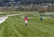 18 March 2021; Jockey Jack Kennedy walks back to the weigh room after the 4/9 favourite Envoi Allen had fallen during The Marsh Novices' Chase on day 3 of the Cheltenham Racing Festival at Prestbury Park in Cheltenham, England. Photo by Hugh Routledge/Sportsfile
