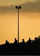 19 March 2021; Supporters watch the game over a wall from outside of the ground during the SSE Airtricity League Premier Division match between Drogheda United and Waterford at Head In The Game Park in Drogheda, Louth. Photo by Seb Daly/Sportsfile