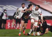 19 March 2021; David McCann of Ulster offloads the ball as he is tackled by Jamie Elliott of Zebre during the Guinness PRO14 match between Ulster and Zebre at Kingspan Stadium in Belfast. Photo by David Fitzgerald/Sportsfile