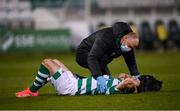 19 March 2021; Shamrock Rovers physiotherapist Tony McCarthy gives medical attention to Aaron Greene of Shamrock Rovers during the SSE Airtricity League Premier Division match between Shamrock Rovers and St Patrick's Athletic at Tallaght Stadium in Dublin. Photo by Stephen McCarthy/Sportsfile