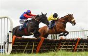 20 March 2021; Sheshoon Sonny, right, with Simon Torrens up, jumps the last on their way to winning the Adare Manor Opportunity Maiden Hurdle from Betty Zane, left, with Paul Cawley up, who finished second, at Thurles Racecourse in Tipperary. Photo by Seb Daly/Sportsfile