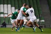 20 March 2021; Jacob Stockdale of Ireland is tackled by Ollie Lawrence, left, and Anthony Watson of England during the Guinness Six Nations Rugby Championship match between Ireland and England at Aviva Stadium in Dublin. Photo by Ramsey Cardy/Sportsfile