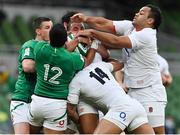 20 March 2021; Ollie Lawrence of England, with the help of team-mates Anthony Watson and Billy Vunipola, holds possession against Bundee Aki, 12, and Jonathan Sexton of Ireland during the Guinness Six Nations Rugby Championship match between Ireland and England at Aviva Stadium in Dublin. Photo by Brendan Moran/Sportsfile