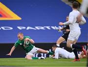 20 March 2021; Keith Earls of Ireland scores his side's first try despite the tackle of Jonny May of England during the Guinness Six Nations Rugby Championship match between Ireland and England at Aviva Stadium in Dublin. Photo by Ramsey Cardy/Sportsfile