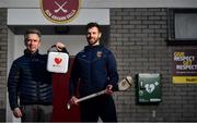 23 March 2021; Antrim hurler Neil McManus and his father Hugh at Cushendall GAA Club in Antrim. Neil is an ambassador for the GAA Community Heart Programme which seeks to raise awareness of the benefits of defibrillators to clubs and make it possible to fundraise to acquire them. Neil's work is inspired by his family experience five years ago when his father was saved by the presence of a defibrillator in the community during an emergency. GAA club-based defibrillators have been used to save 42 lives. For more information see:  https://savealife.communityheartprogram.com/gaa. Photo by David Fitzgerald/Sportsfile
