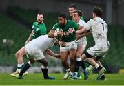 20 March 2021; Bundee Aki of Ireland is tackled by Jamie George and George Ford of England during the Guinness Six Nations Rugby Championship match between Ireland and England at Aviva Stadium in Dublin. Photo by Brendan Moran/Sportsfile