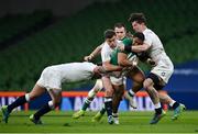 20 March 2021; Bundee Aki of Ireland is tackled by Jamie George, left, George Ford, centre, and Tom Curry of England during the Guinness Six Nations Rugby Championship match between Ireland and England at Aviva Stadium in Dublin. Photo by Ramsey Cardy/Sportsfile