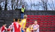 20 March 2021; A Longford Town official watches during the SSE Airtricity League Premier Division match between Longford Town and Derry City at Bishopsgate in Longford. Photo by Eóin Noonan/Sportsfile