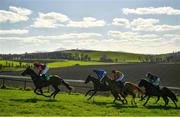 21 March 2021; A general view as runners and riders make their way up the hill in the WKD Handicap Hurdle at Downpatrick Racecourse in Downpatrick. Photo by Harry Murphy/Sportsfile