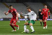 24 March 2021; Callum Robinson of Republic of Ireland crosses the ball leading up to his side's first goal, scored by Alan Browne, despite the attention of Stefan Mitrovic of Serbia during the FIFA World Cup 2022 qualifying group A match between Serbia and Republic of Ireland at Stadion Rajko Mitic in Belgrade, Serbia. Photo by Stephen McCarthy/Sportsfile