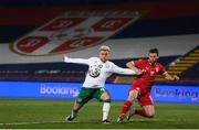 24 March 2021; Aaron Connolly of Republic of Ireland and Milan Gajic of Serbia during the FIFA World Cup 2022 qualifying group A match between Serbia and Republic of Ireland at Stadion Rajko Mitic in Belgrade, Serbia. Photo by Stephen McCarthy/Sportsfile