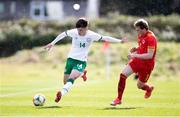 26 March 2021; Alex Gilbert of Republic of Ireland in action against Edward Jones of Wales during the U21 International friendly match between Wales and Republic of Ireland at Colliers Park in Wrexham, Wales. Photo by David Rawcliffe/Sportsfile