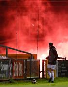 26 March 2021; Darragh Crowley of Cork City looks on as a flare is lit over the fence during the SSE Airtricity League First Division match between Cork City and Cobh Ramblers at Turners Cross in Cork. Photo by Harry Murphy/Sportsfile