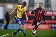 27 March 2021; Paddy Kirk of Longford Town in action against Liam Burt of Bohemians during the SSE Airtricity League Premier Division match between Bohemians and Longford Town at Dalymount Park in Dublin. Photo by Sam Barnes/Sportsfile
