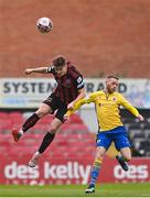 27 March 2021; Rory Feely of Bohemians wins a header ahead of Dean Byrne of Longford Town during the SSE Airtricity League Premier Division match between Bohemians and Longford Town at Dalymount Park in Dublin. Photo by Sam Barnes/Sportsfile