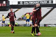 27 March 2021; Georgie Kelly of Bohemians, right, celebrates with team-mates, including Liam Burt, after scoring his side's first goal during the SSE Airtricity League Premier Division match between Bohemians and Longford Town at Dalymount Park in Dublin. Photo by Sam Barnes/Sportsfile