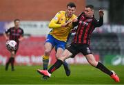 27 March 2021; Callum Warfield of Longford Town is tackled by James Finnerty of Bohemians during the SSE Airtricity League Premier Division match between Bohemians and Longford Town at Dalymount Park in Dublin. Photo by Sam Barnes/Sportsfile