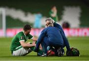 27 March 2021; Matt Doherty of Republic of Ireland receives medical attention from Dr Alan Byrne, Republic of Ireland team doctor, right, and Danny Miller, Republic of Ireland chartered physiotherapist, during the FIFA World Cup 2022 qualifying group A match between Republic of Ireland and Luxembourg at the Aviva Stadium in Dublin. Photo by Seb Daly/Sportsfile
