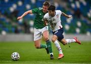 28 March 2021; Christian Pulišic of USA in action against Daniel Ballard of Northern Ireland during the International friendly match between Northern Ireland and USA at the National Football Stadium at Windsor Park in Belfast. Photo by David Fitzgerald/Sportsfile