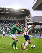 28 March 2021; Christian Pulišic of USA in action against Niall McGinn of Northern Ireland during the International friendly match between Northern Ireland and USA at National Football Stadium at Windsor Park in Belfast. Photo by David Fitzgerald/Sportsfile