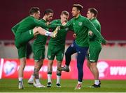30 March 2021; Republic of Ireland players, from left, Ronan Curtis, Alan Browne, James McClean, Callum Robinson and James Collins warm-up ahead of the international friendly match between Qatar and Republic of Ireland at Nagyerdei Stadion in Debrecen, Hungary. Photo by Stephen McCarthy/Sportsfile